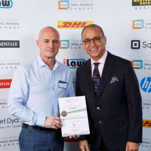 Chris Straker receiving SBS award, from Theo Paphitis